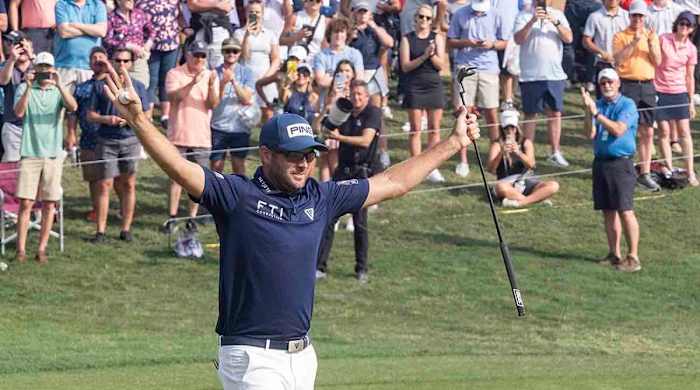 Corey Conners celebrates after winning the 2023 Valero Texas Open.